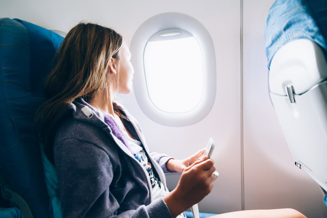 Girl Flying in Airplane